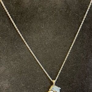 Jumping dolphin necklace on silver tone chain with blue rhinestone studs 18”